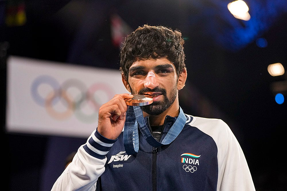 | Photo: PTI/Ravi Choudhary : Wrestling bronze medalist India’s Aman Sehrawat poses for photos 